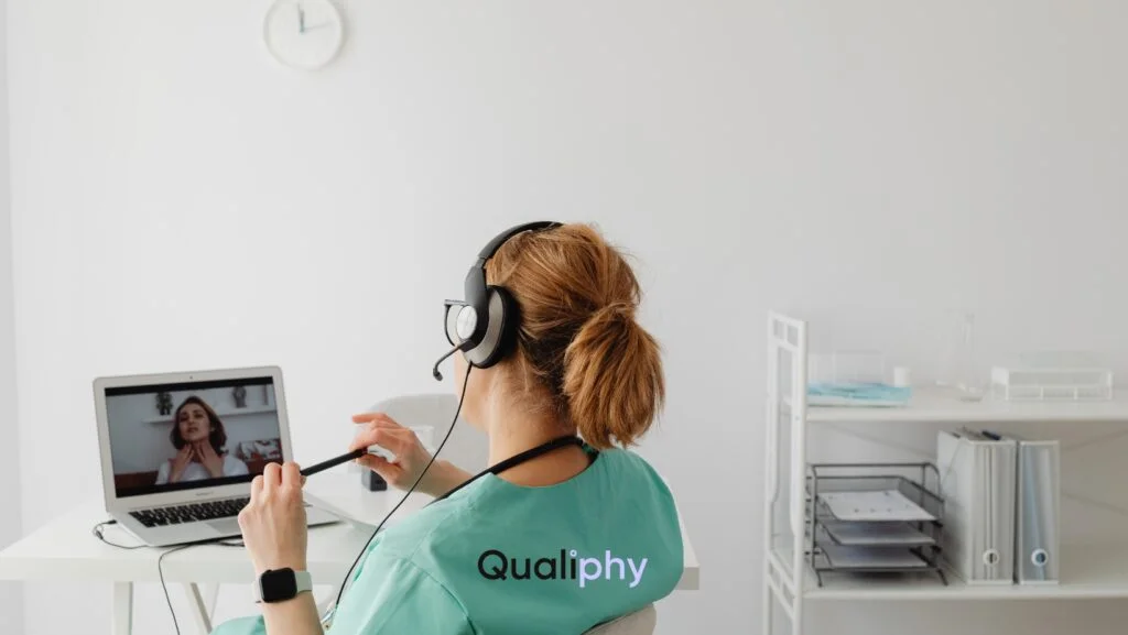 A healthcare provider conducts a virtual consultation on a laptop, showcasing how easy it is to start a telehealth business using automated, patient-first technology.