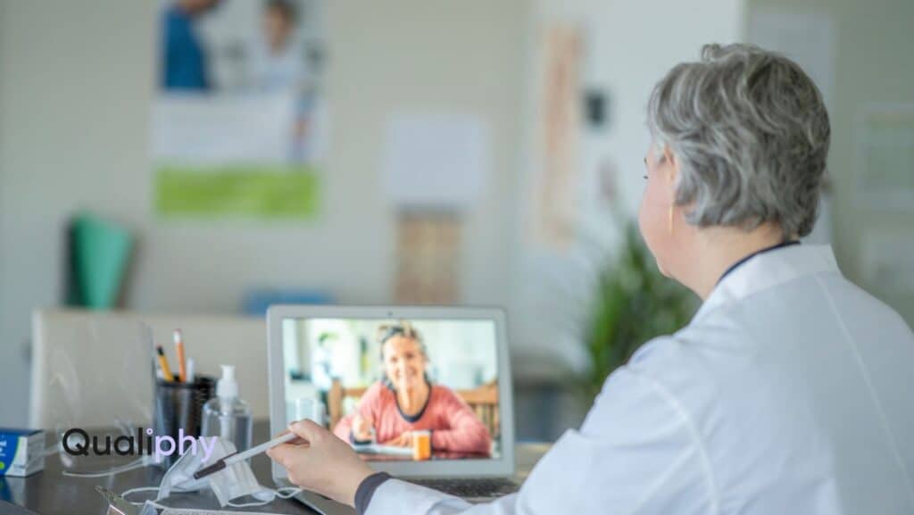 Licensed medical provider conducting a synchronous telehealth Good Faith Exam with a patient over video call, demonstrating compliance-focused virtual care through Qualiphy.
