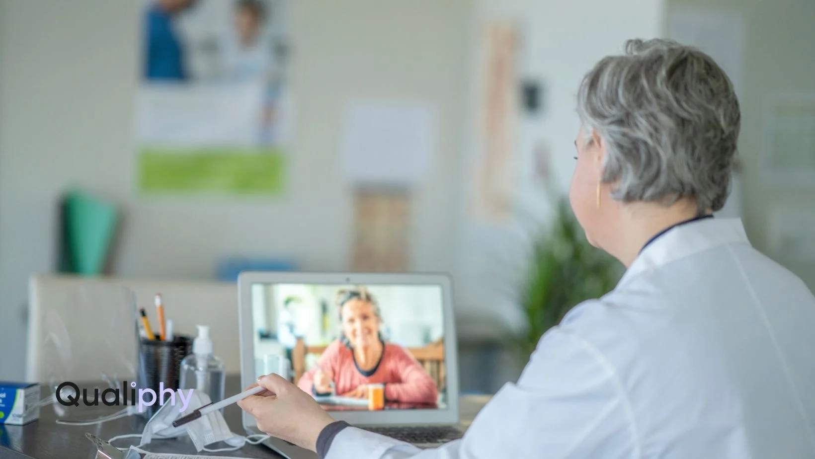 Licensed medical provider conducting a synchronous telehealth Good Faith Exam with a patient over video call, demonstrating compliance-focused virtual care through Qualiphy.
