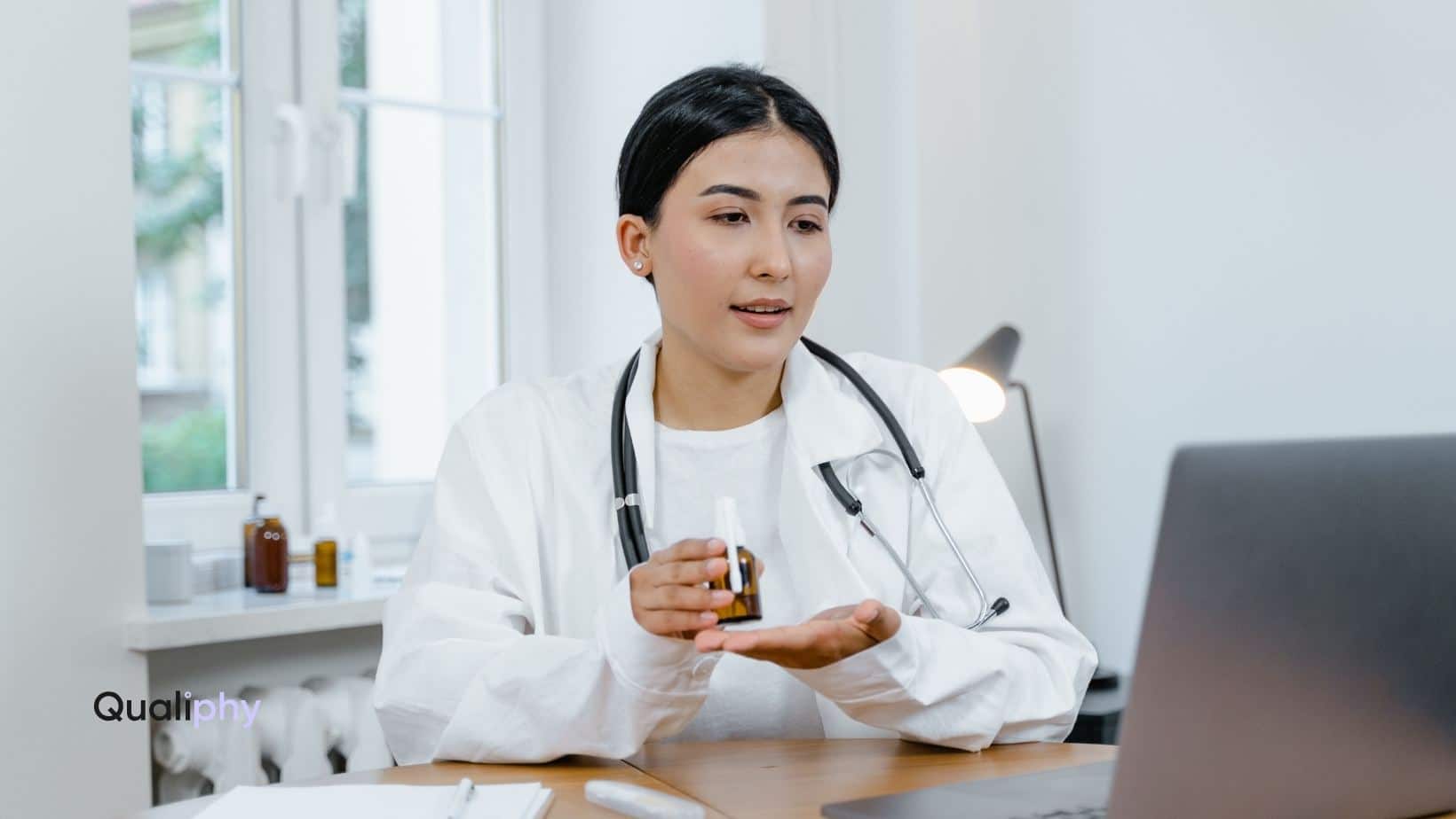 A telehealth provider conducting a virtual consultation, demonstrating medication to a patient via video call, representing pay-per-use telehealth services for medspas.