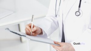 A licensed medical doctor reviewing delegation and supervision agreements for IV therapy compliance in a medical spa, ensuring treatments meet state regulations under Jenifer’s Law and proper provider oversight.