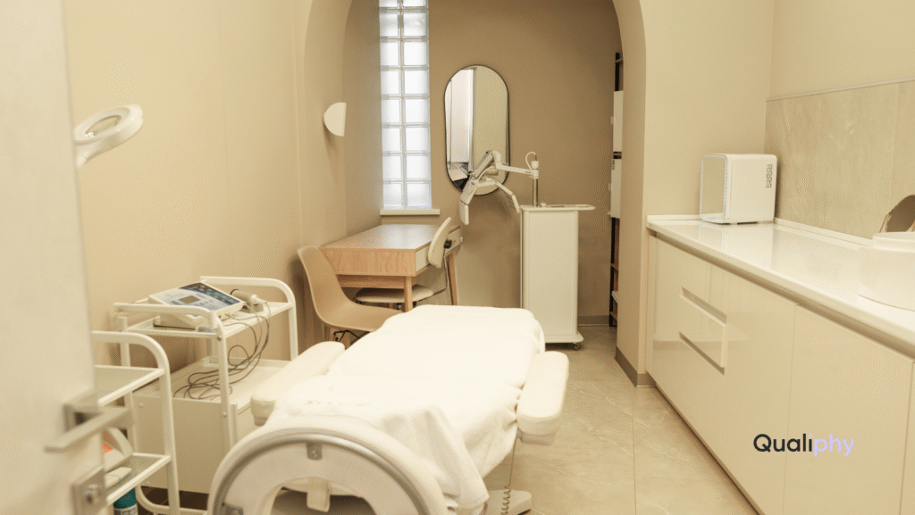 A modern med spa treatment room with aesthetic equipment, treatment bed, and clean neutral design, representing a professional clinical environment used in MedSpa Marketing content.