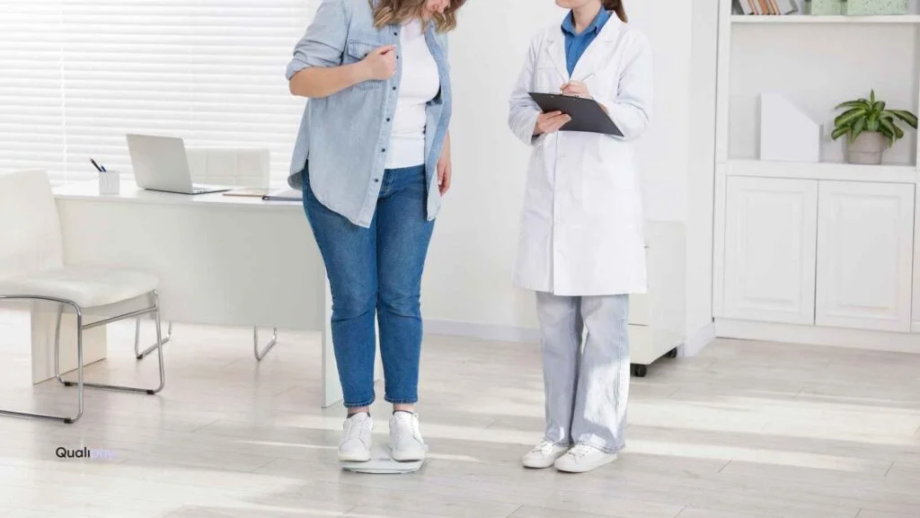 Doctor consulting with a female patient during a medical weight loss appointment, highlighting compliance risks for weight loss clinics and GLP-1 treatment programs.