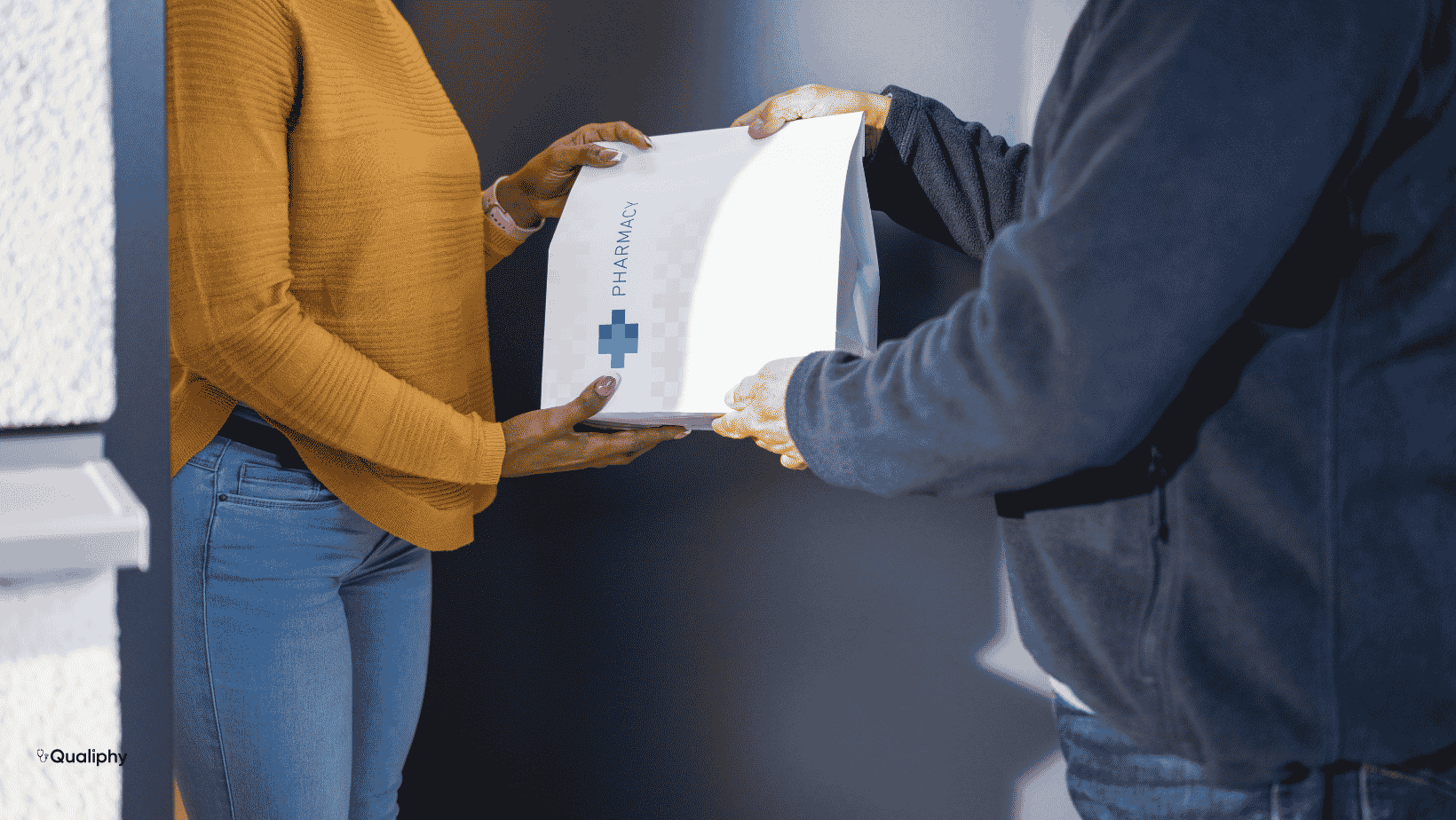 Prescription package being handed to a patient